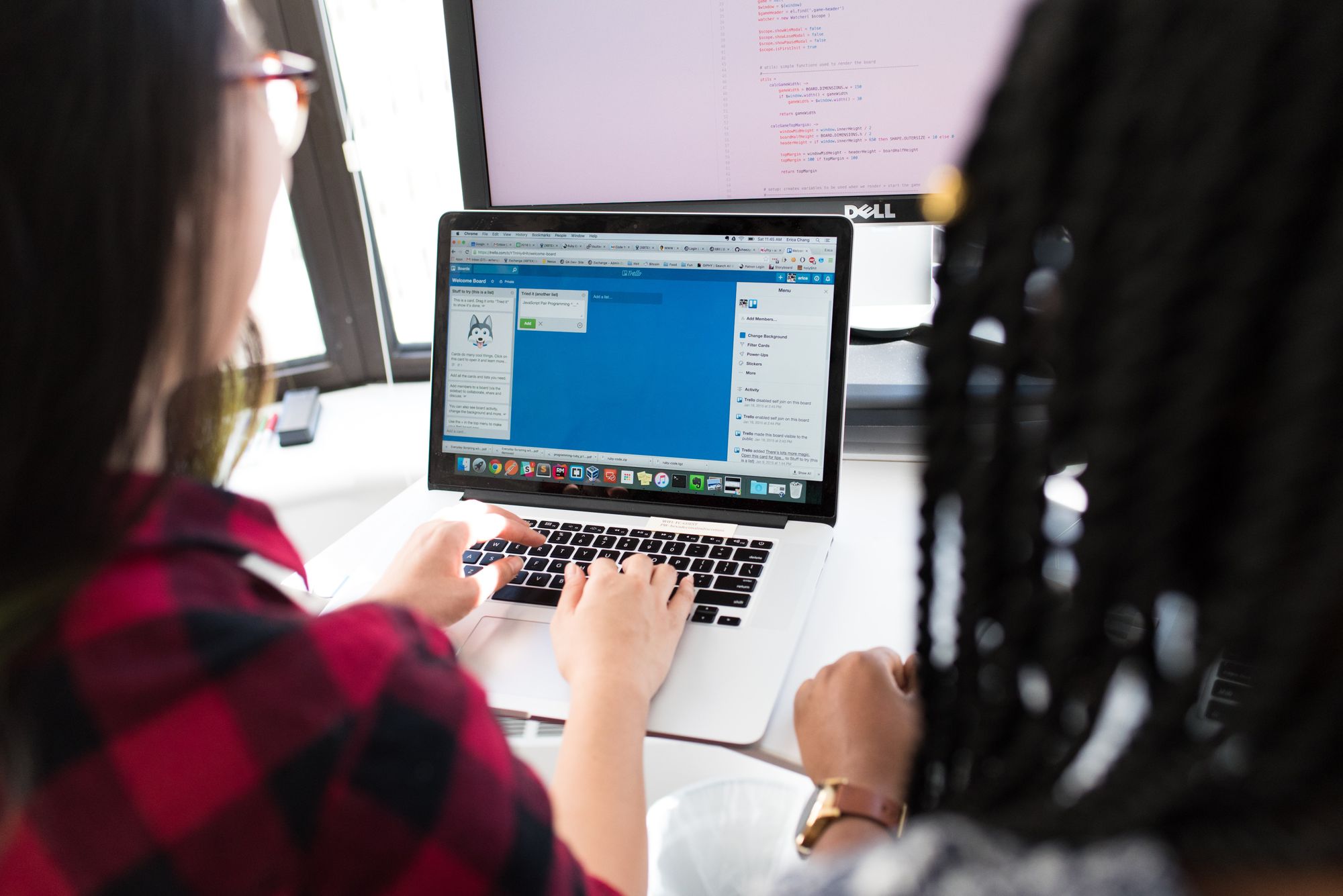 Two women looking at a laptop screen